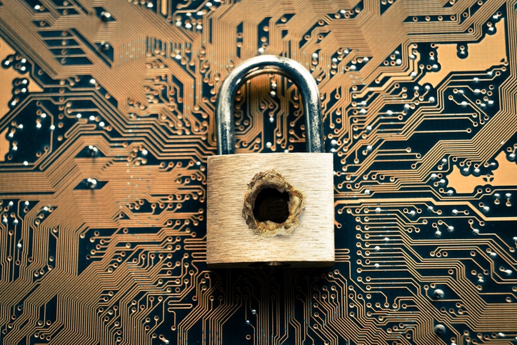 A penetrated security lock with aa hole on computer circuit board background